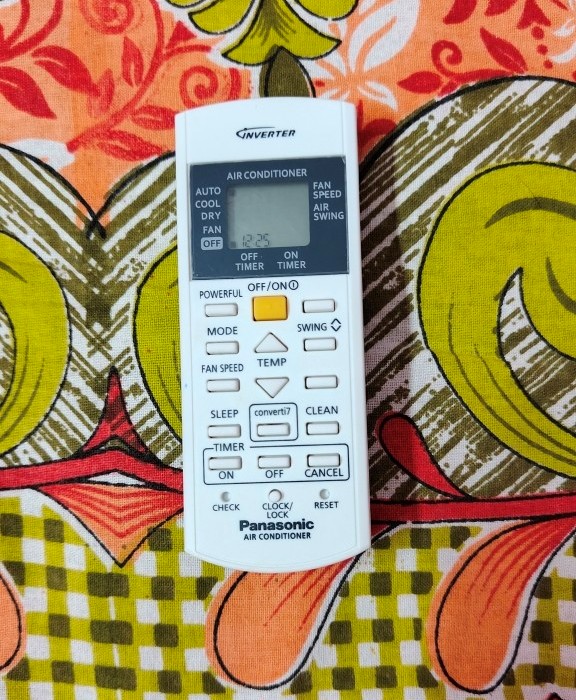 Close-up of Panasonic air conditioner remote (CSCU-NU18AKY5WX) highlighting the Powerful button at the top left